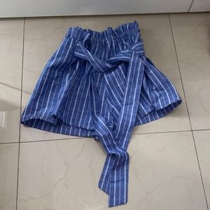 Blue and white shorts with tie.